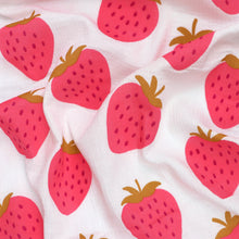 A white fabric with strawberries print